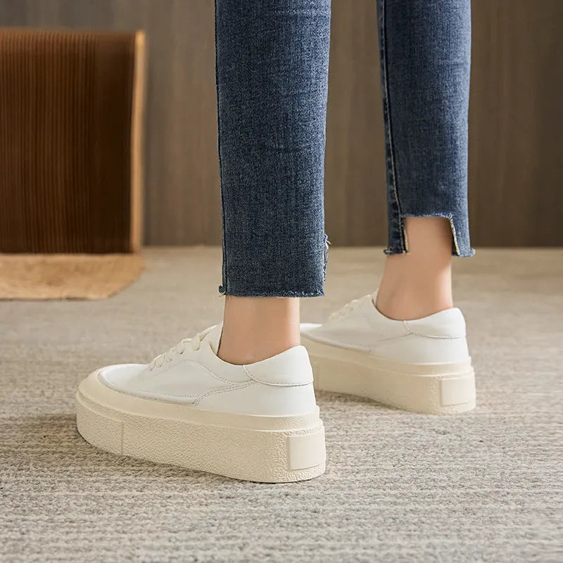 Women's black and white platform casual shoes with embossed cowhide leather and round toe design