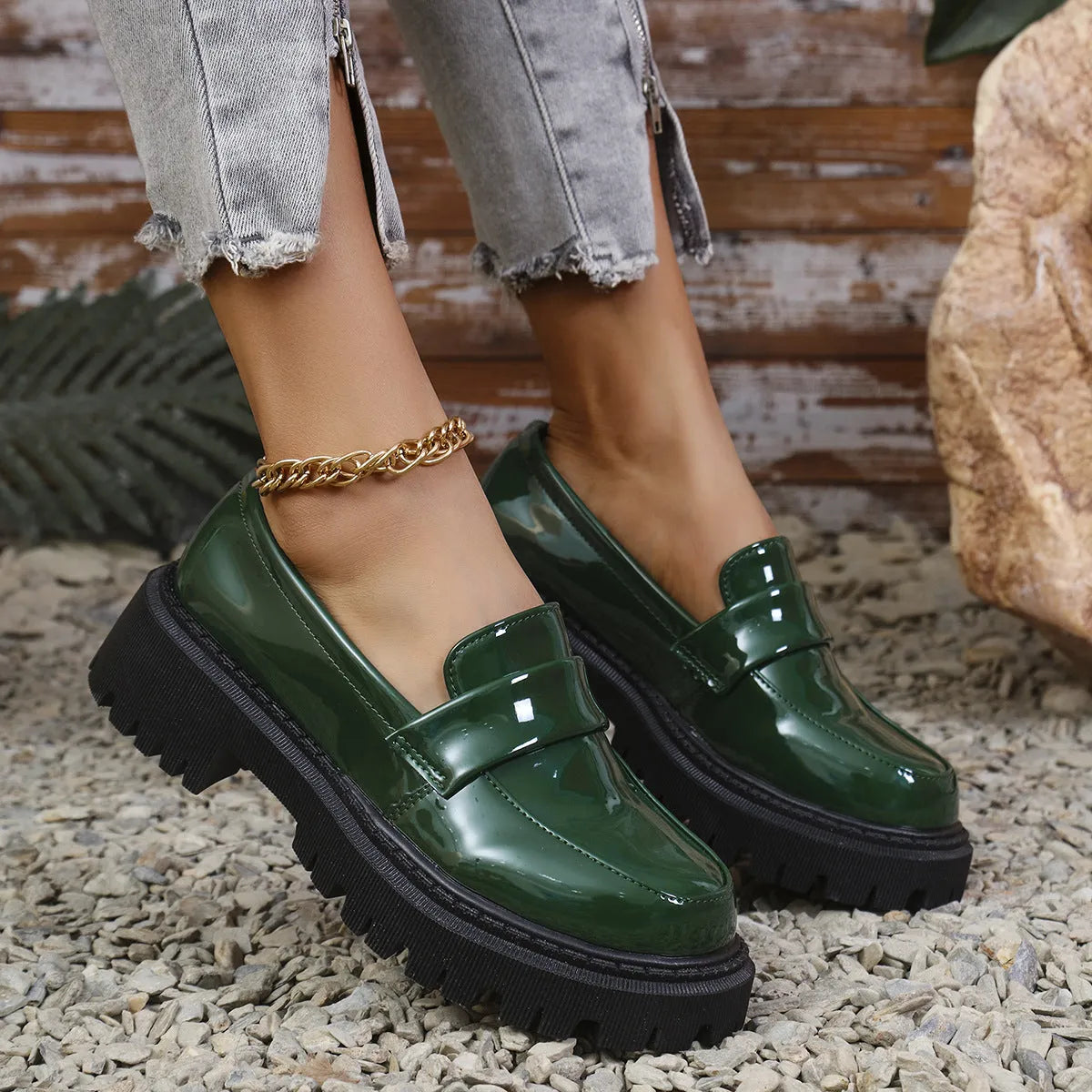 Women's black slip-on loafers with chunky platform heel and solid colour design