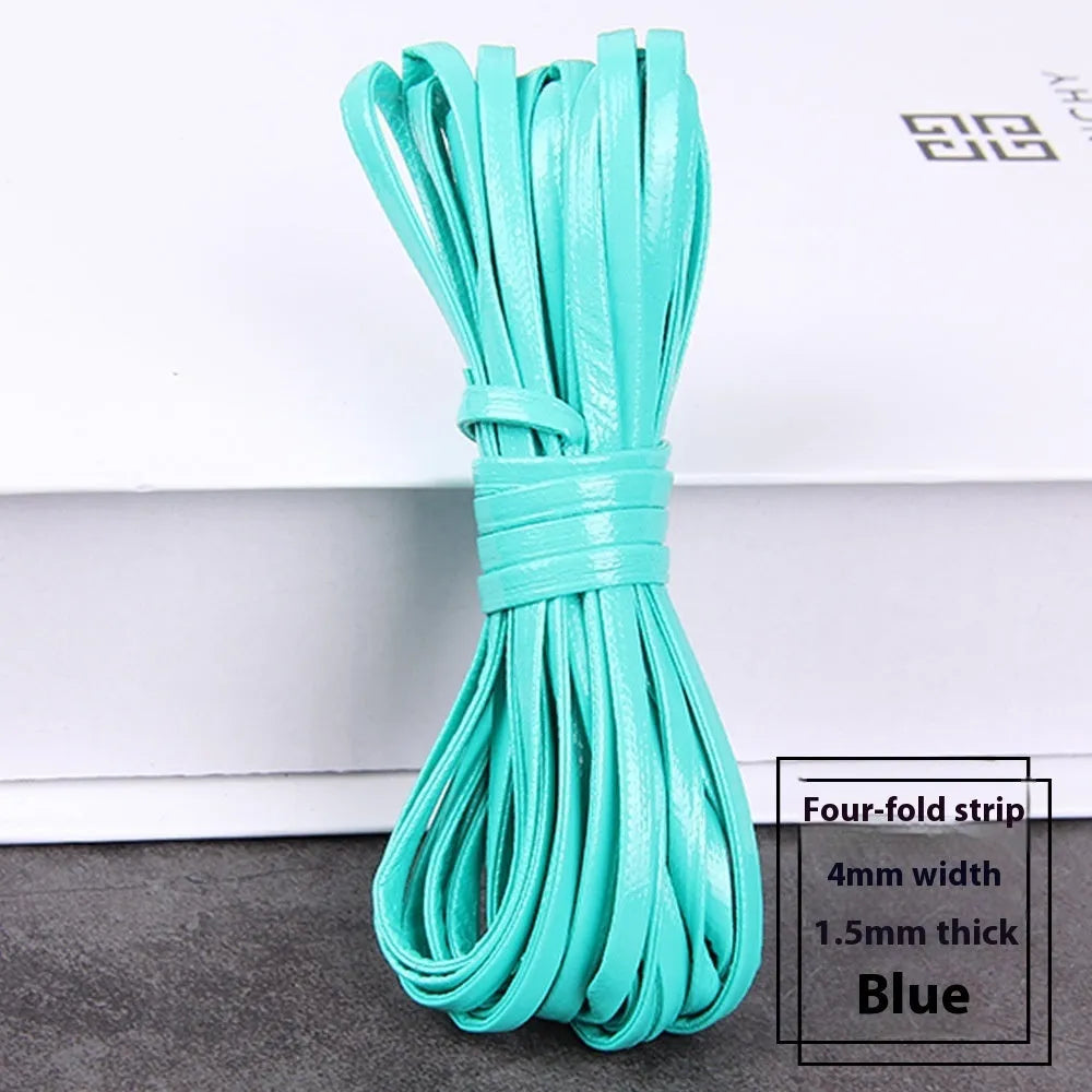 Spool of soft beige PU leather woven cord for DIY crafts and jewellery making.