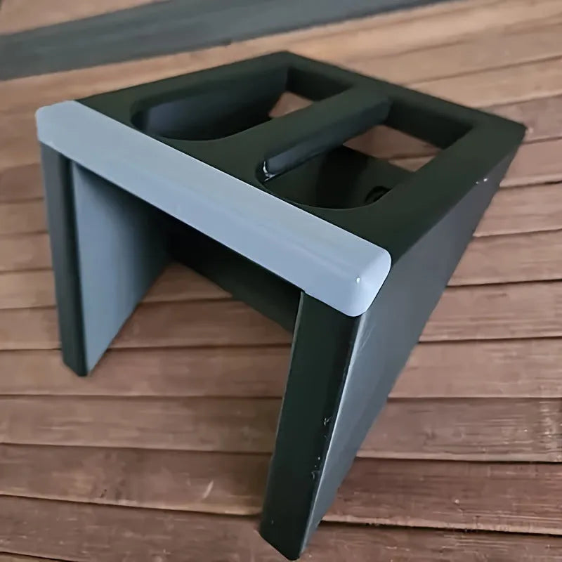 Black punk-style plastic pistol stand for airsoft gun display