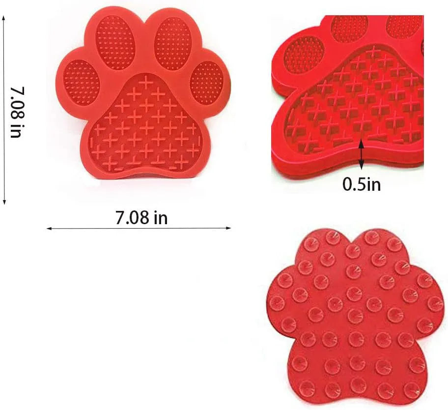 Blue silicone dog licking mat with bone-shape texture and suction cups on a tiled wall.
