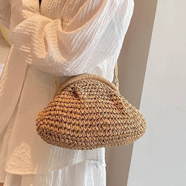 Women's straw beach shoulder bag in khaki colour with chain detailing and shell shape