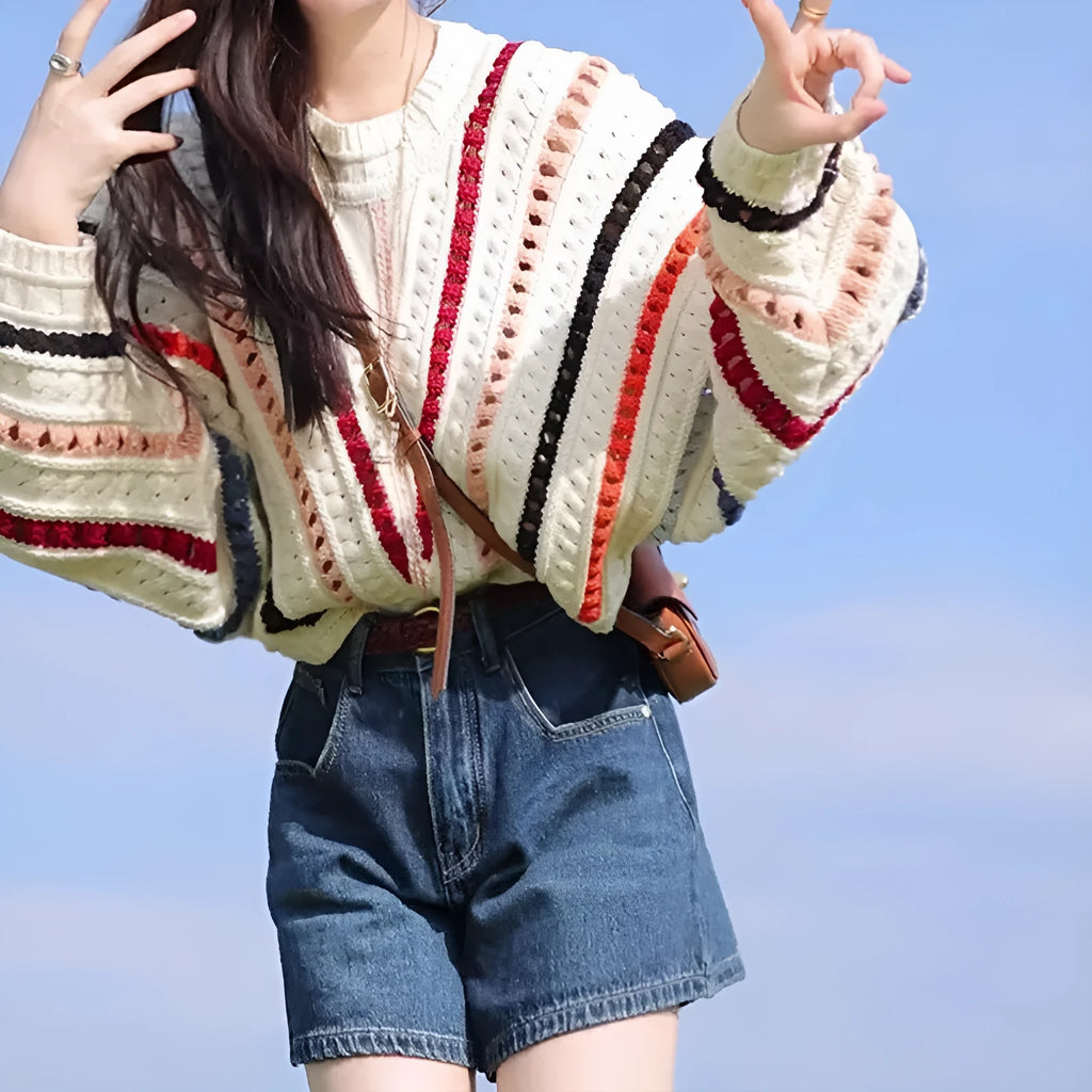 Rainbow striped hollow pattern sweater with batwing sleeves in loose fitting casual style