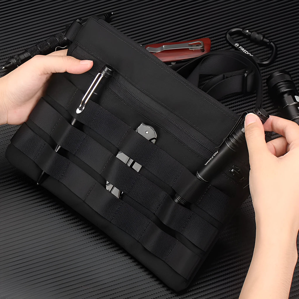 Black Oxford cloth military utility bag measuring 18 by 3.5 centimetres