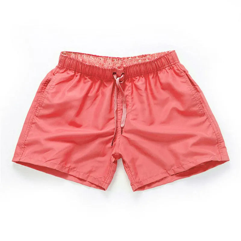 Men's straight-leg beach shorts in polyester, shown in a selection of available colours.