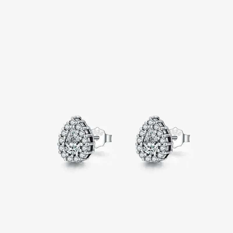 A pair of women's sterling silver water drop shaped stud earrings with a diamond-cut finish.