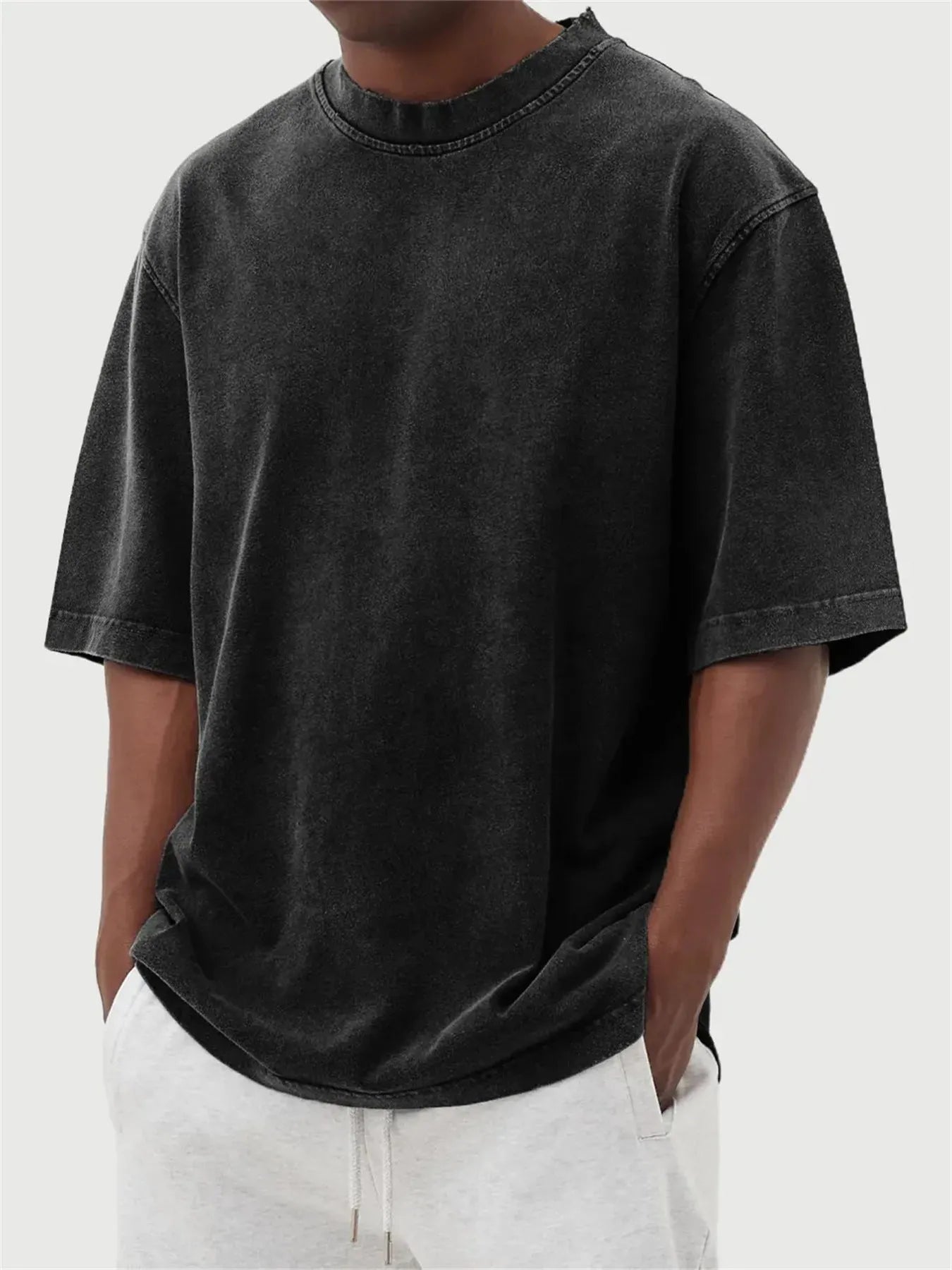 Men's loose fit distressed stone wash pullover t-shirt in solid colours like army green and blue.