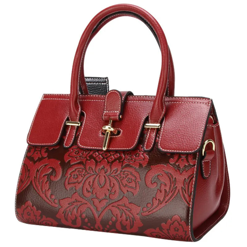 Genuine leather women's vintage crossbody bag in oval shape with embossed detailing