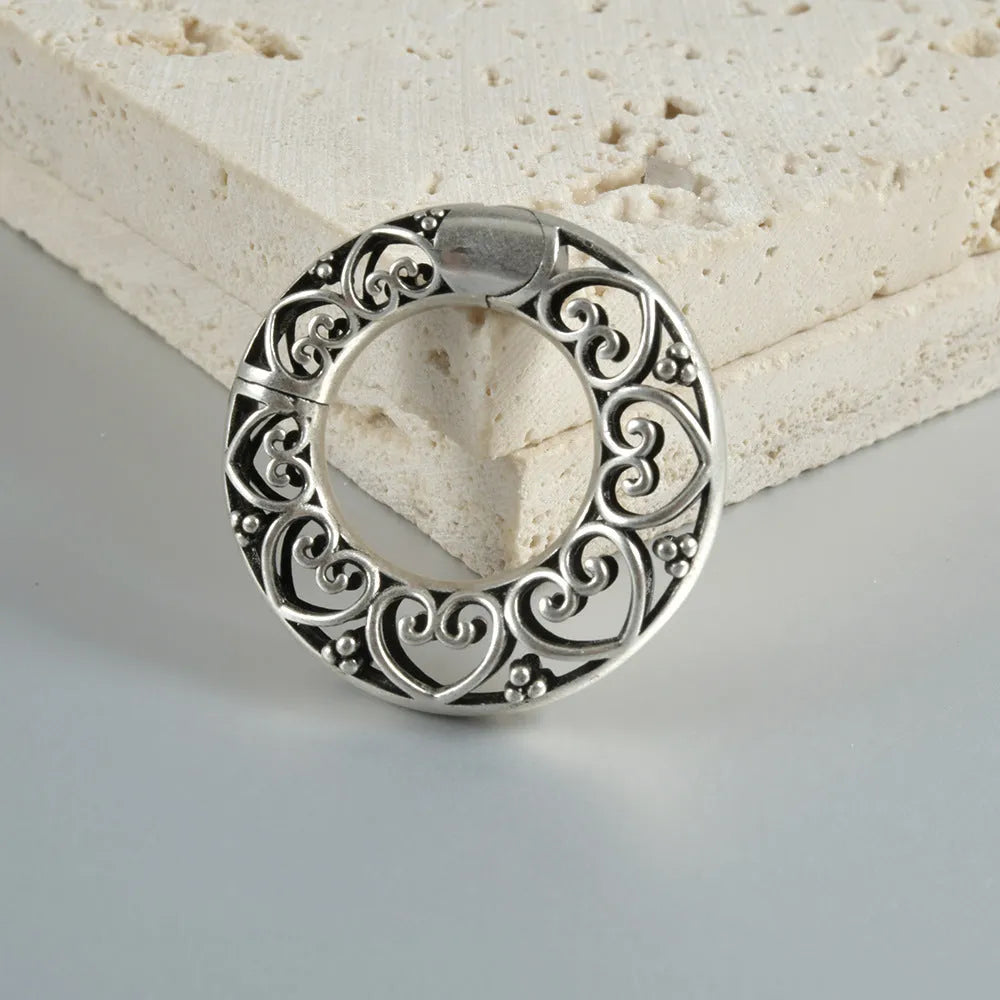 Retro heart-shaped hollow lotus magnetic earrings in stainless steel with antique silver finish