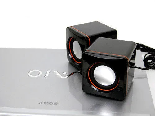 Small black square computer speaker with USB cable for PC connection