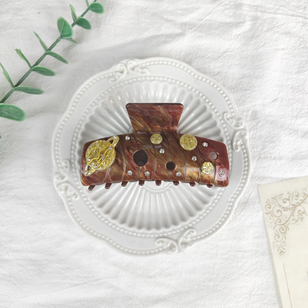 Oversized women's barrette hair clip with a starry sky pattern in sky blue.