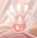 Pink octopus-shaped natural resin massage comb for facial and head massage on a plain background.