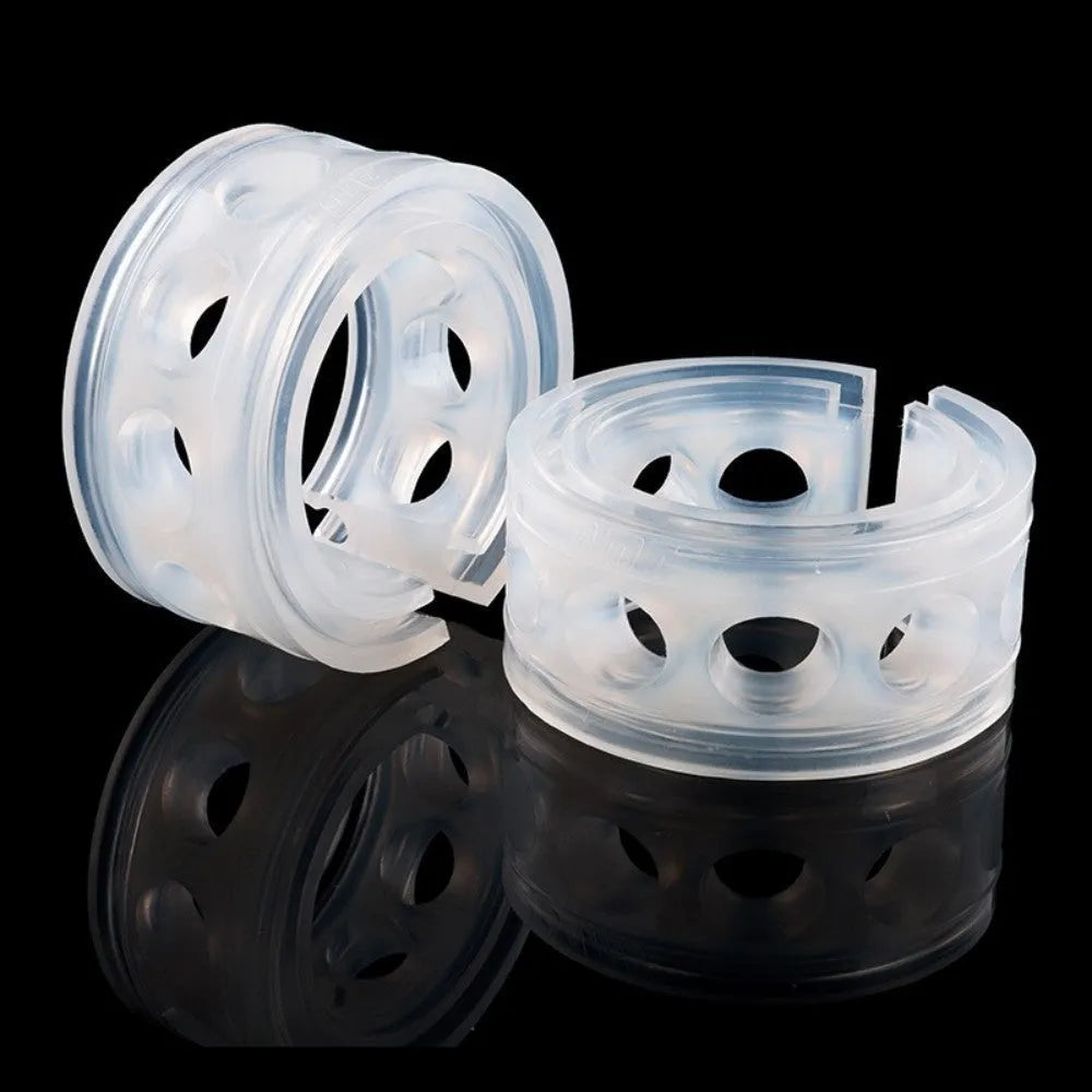 A pair of transparent rubber shock absorbers for car suspension springs, shown with size measurement diagram.