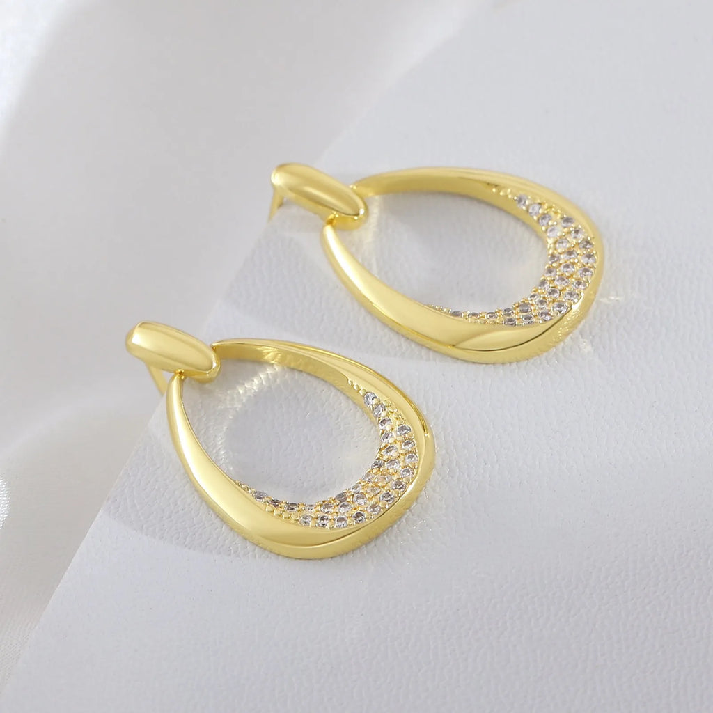 Women's yellow gold geometric drop earrings with zircon detailing measuring 2.6cm by 1.7cm