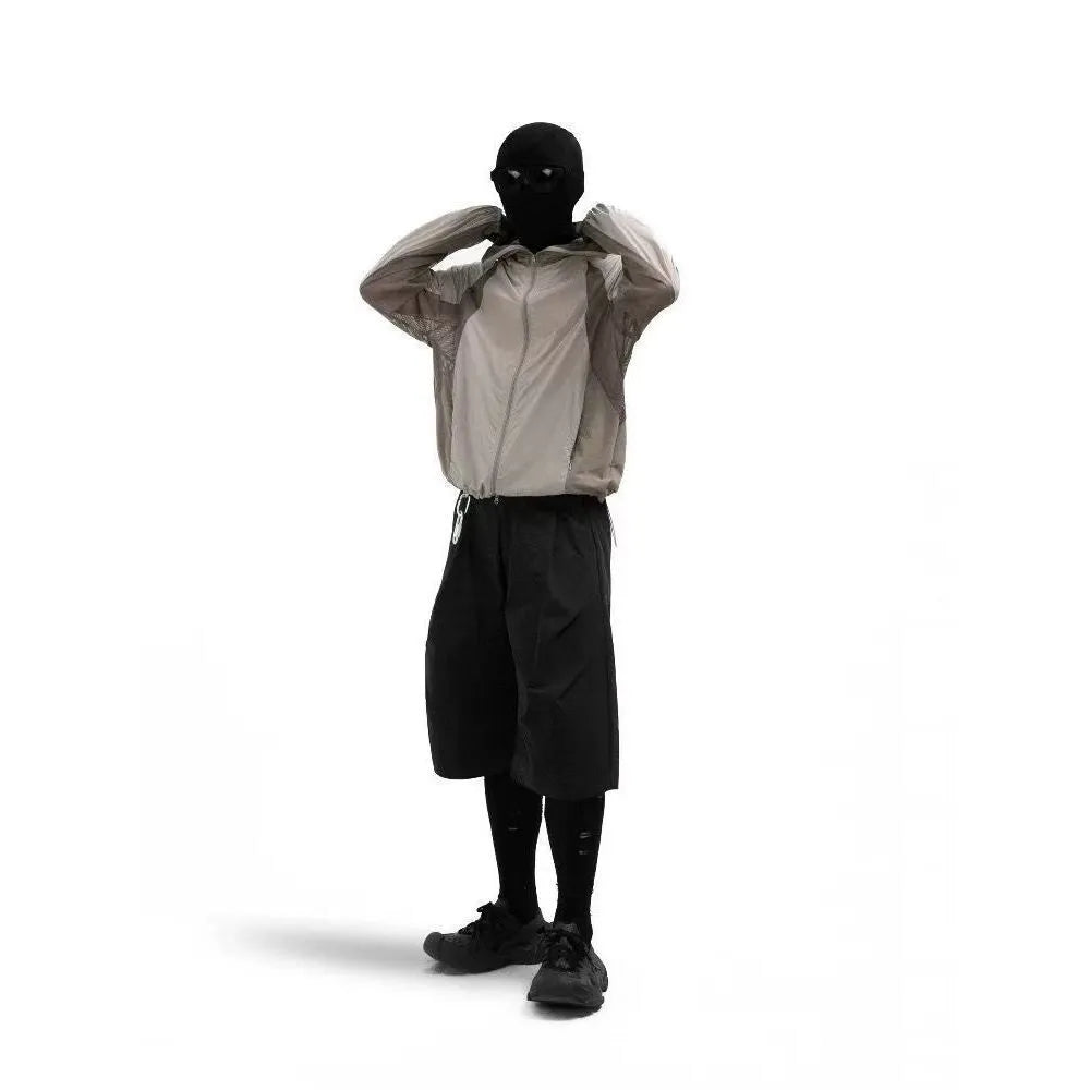 Mesh-stitched sun protective clothing in desert brown, thin nylon fabric for UV protection.