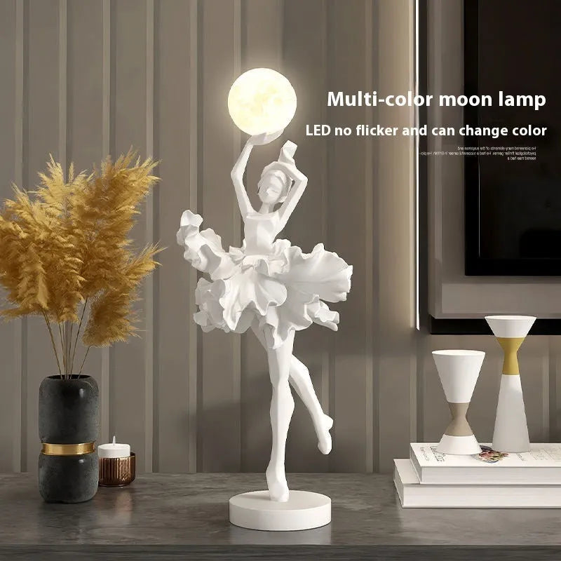Small resin night light ornament in black gold colour with USB charging cable