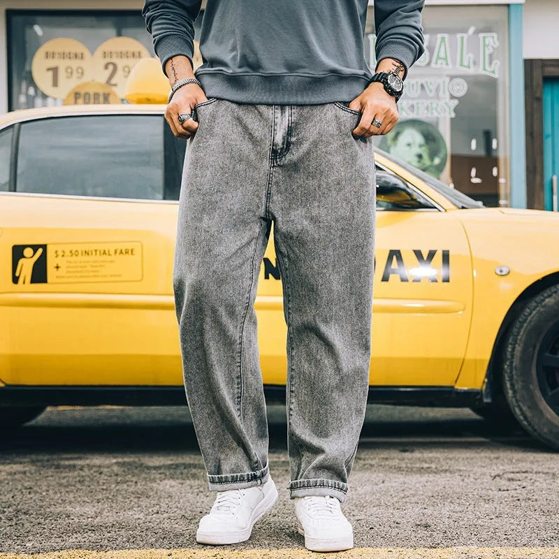Men's loose straight jeans in dark blue colour showing mid waist and straight leg design
