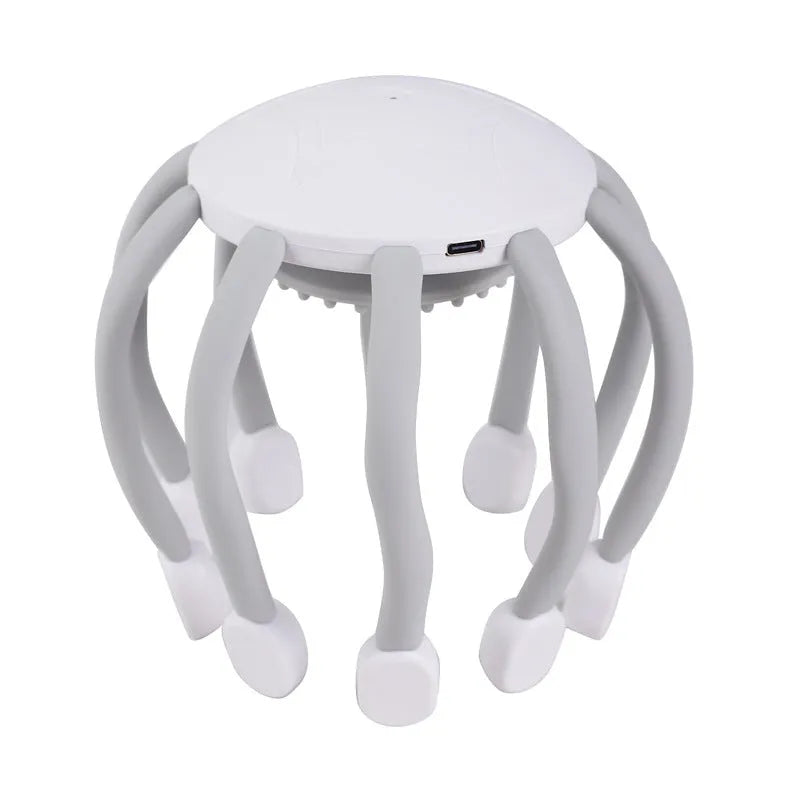 Black head massager with multiple vibrating claws on a scalp, showing four speed mode buttons and USB charging port