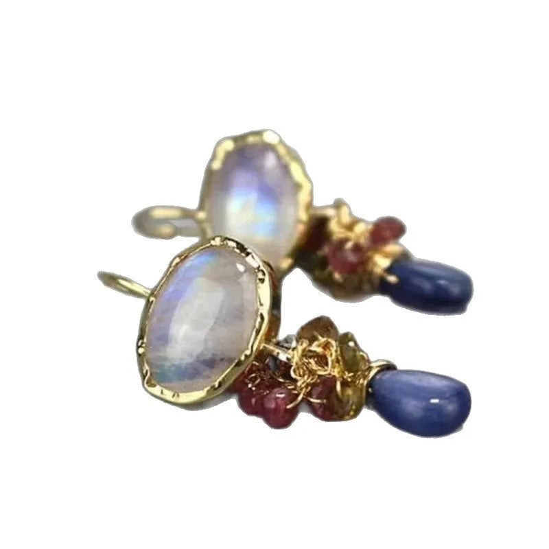 Retro vertical earrings with colored stones in geometric copper design, micro-set style