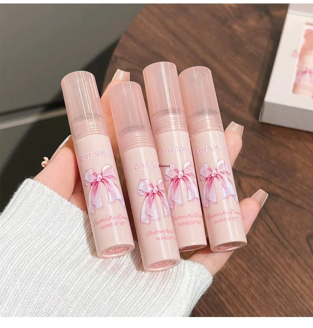 Butterfly Box makeup set with four lip muds, powder blusher and necklace in pink packaging