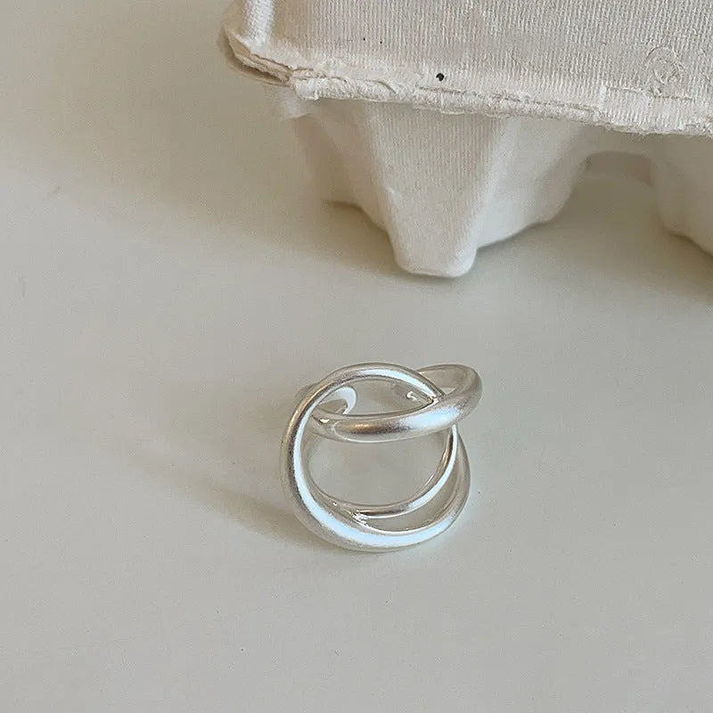 Geometric open ring for women with interlaced matte metal design and real gold plating