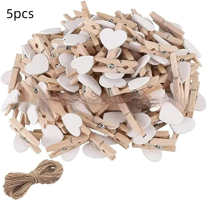 Five solid wood heart-shaped clips in different colours showing handmade construction details