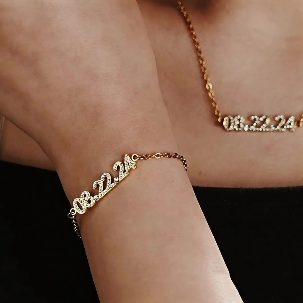 Stainless steel digital bracelet with diamond numerals on a metallic background.