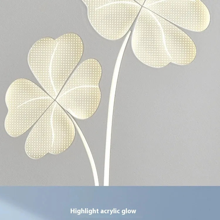 Modern bedside lamp with acrylic shade and iron base showing tricolour LED light and decorative heart design.