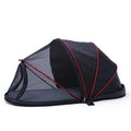 Portable folding cloth tent for cats in blue half mesh variant, set up as a travel bed.