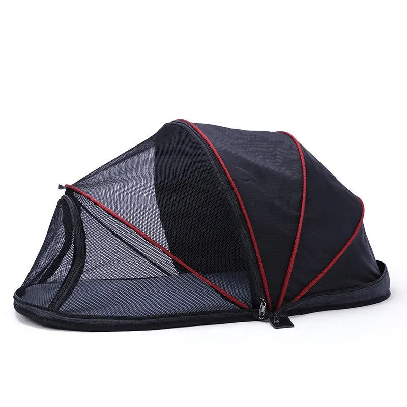 Portable folding cloth tent for cats in blue half mesh variant, set up as a travel bed.