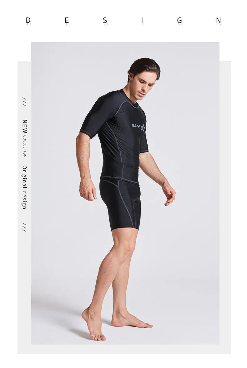 Men's navy blue quick-drying nylon swimsuit set with half-sleeve top and pants for swimming and surfing.