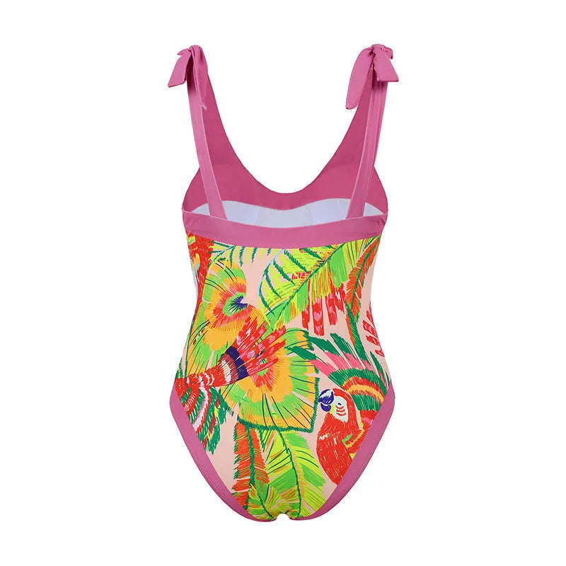 Pink floral print one-piece swimsuit with V-neck, covered belly, and an attached skirt.