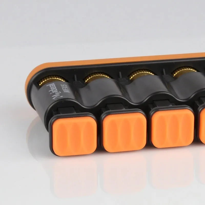 Grey non-slip silicone finger trainer for piano and guitar practice on a table.