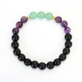 Lotus pendant necklace with stone beads on adjustable ball bead chain alongside matching bracelet