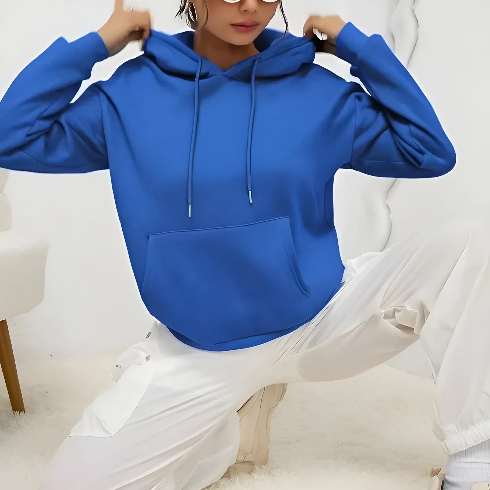 Women's loose fit grey drawstring hood sweatshirt with front pockets, long sleeves