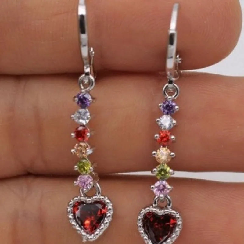 A pair of women's heart-shaped alloy earrings in gold or silver electroplated finish.