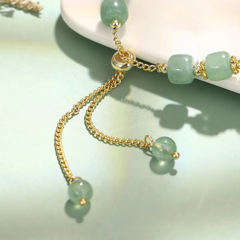 Women's rabbit charm bracelet with natural stone beads and gold accents