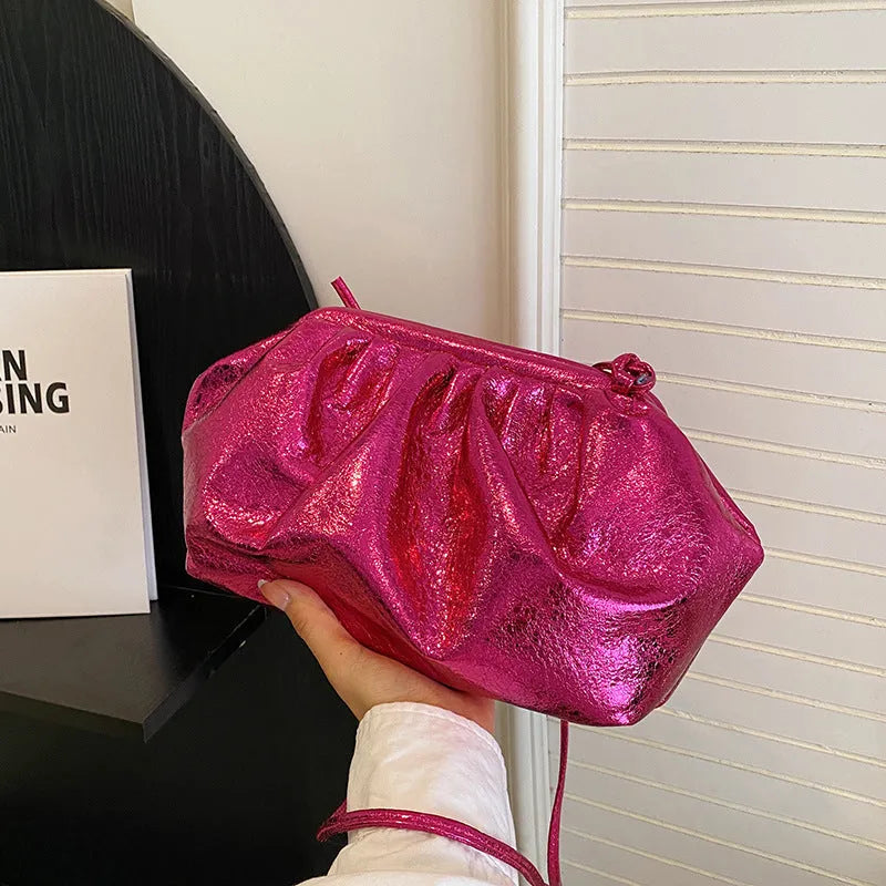Shell-shaped shoulder crossbody bag with hair clip closure in rose red colour showing interior organisation compartments