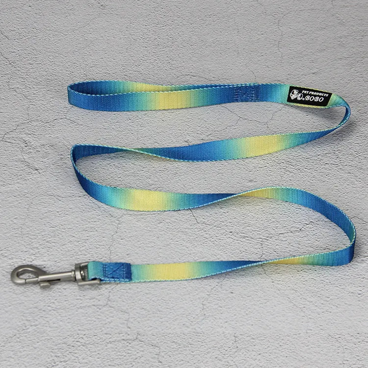 Gradient colour nylon dog leash set showing pink and yellow colour blend on a chest back harness style.