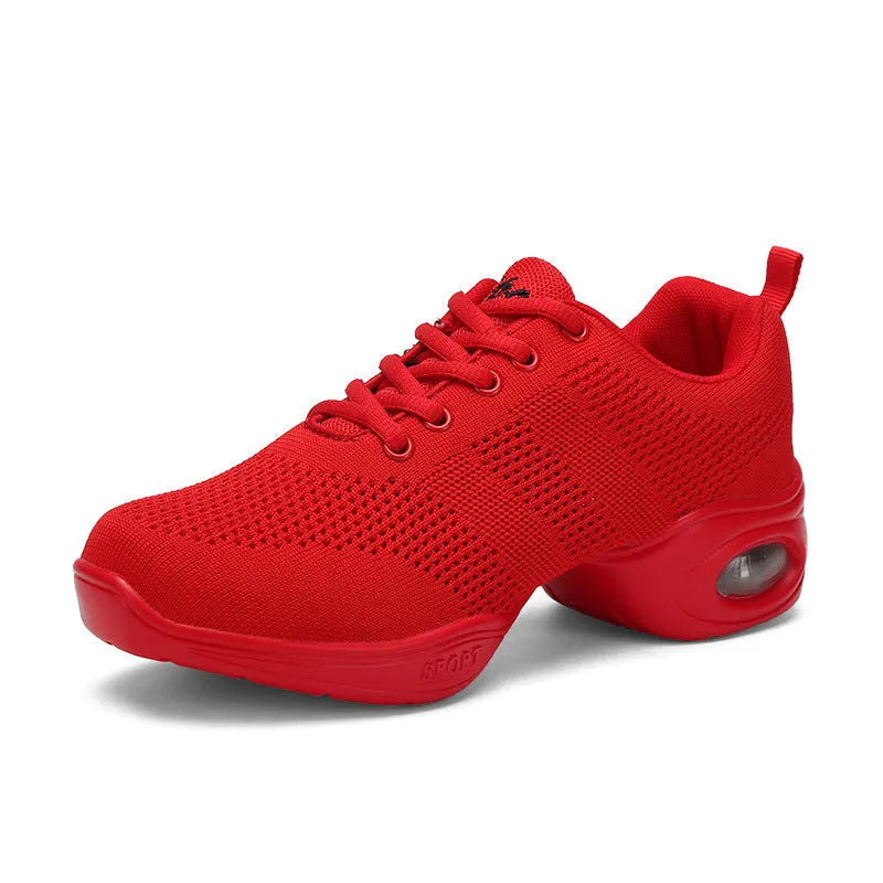 Women's white breathable flyknit mesh dancing shoes with a soft PU sole on a light background.