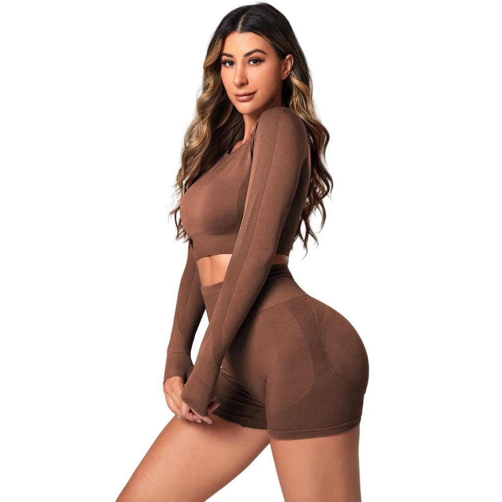 Women's black yoga suit with high waist hip lift design and long sleeves for fitness activities