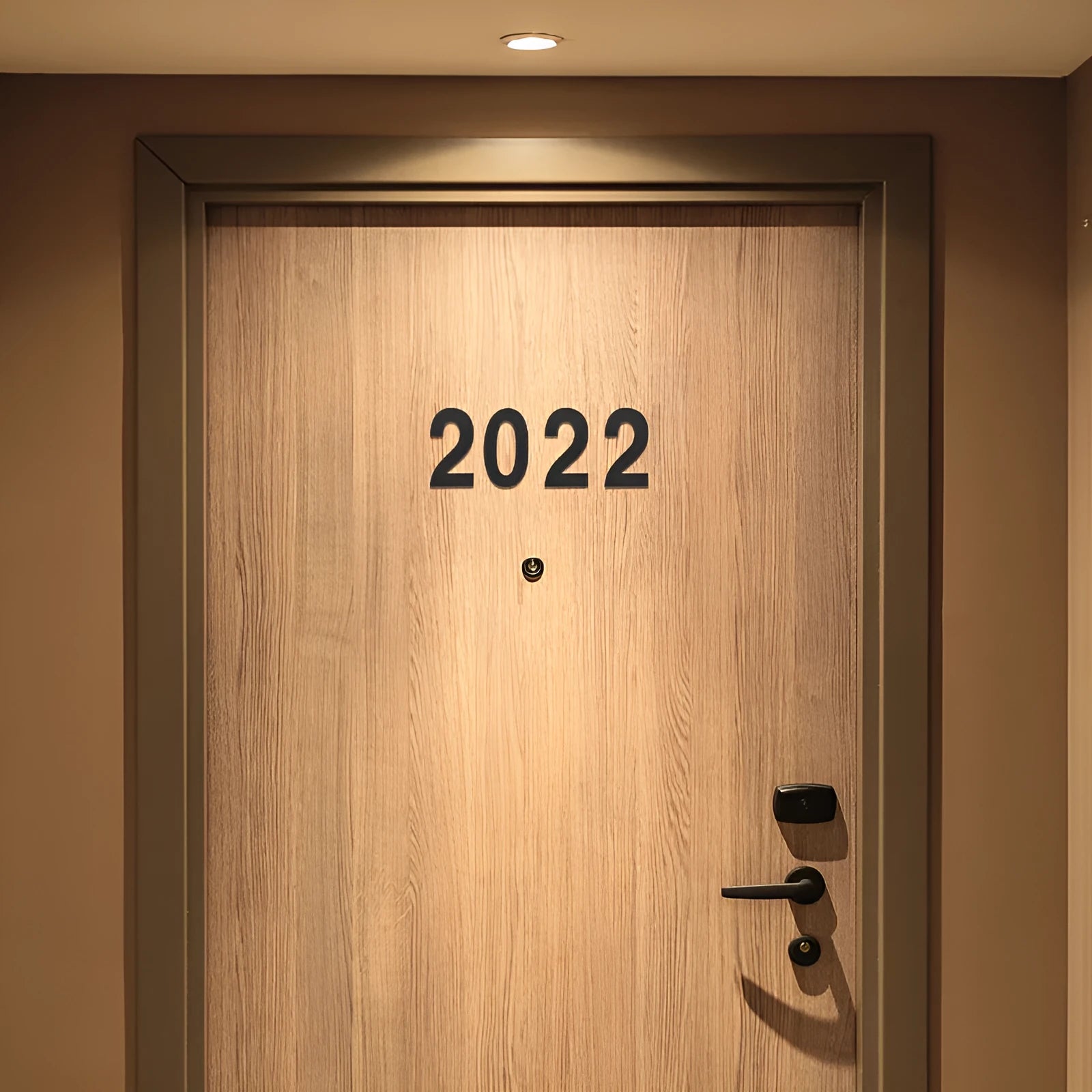Black stainless steel sticky adhesive house number showing character size of 7.5cm.