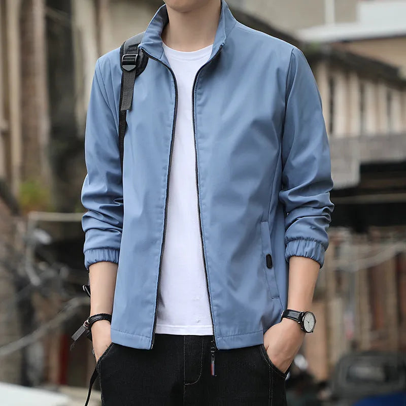 Korean style loose fit casual jacket in black with zip and patch pockets on a man.