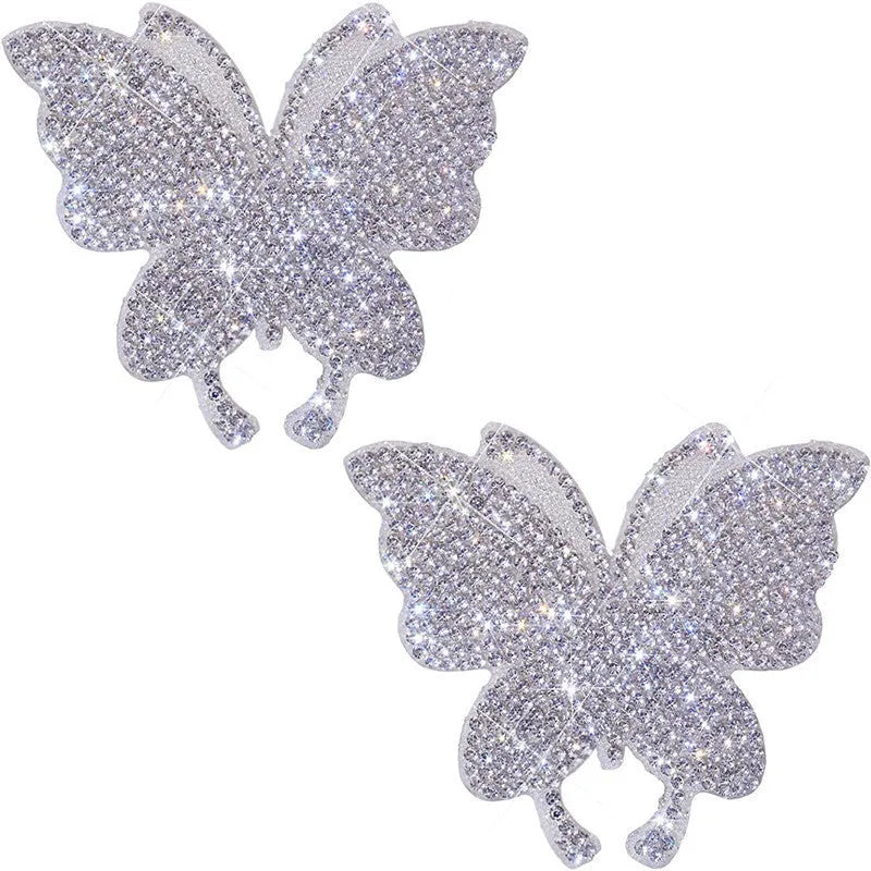 Diamond-encrusted glass car sticker showing butterfly and bear paw designs, scale next to a 7x6 cm measurement.