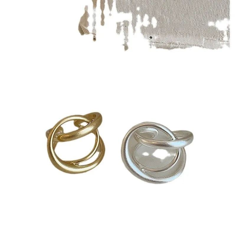 Geometric open ring for women with interlaced matte metal design and real gold plating