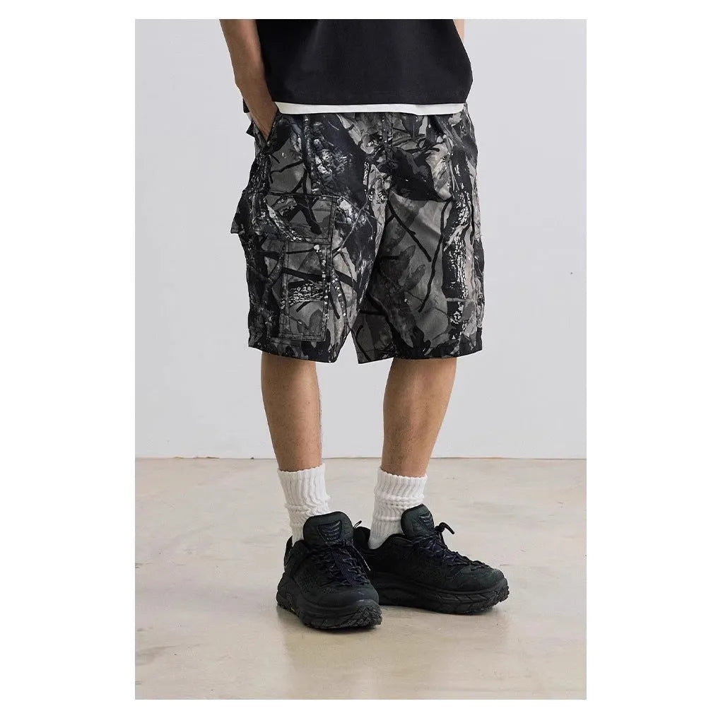 Loose casual straight-leg denim shorts in army green with a zip fly and elasticated waistband.