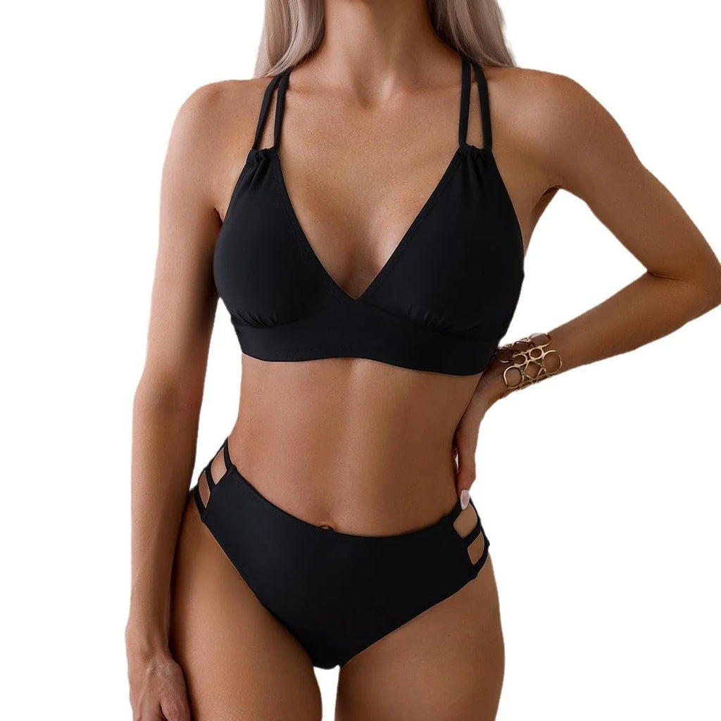 Women's black V-neck halter bikini with removable padded bra and split shorts.