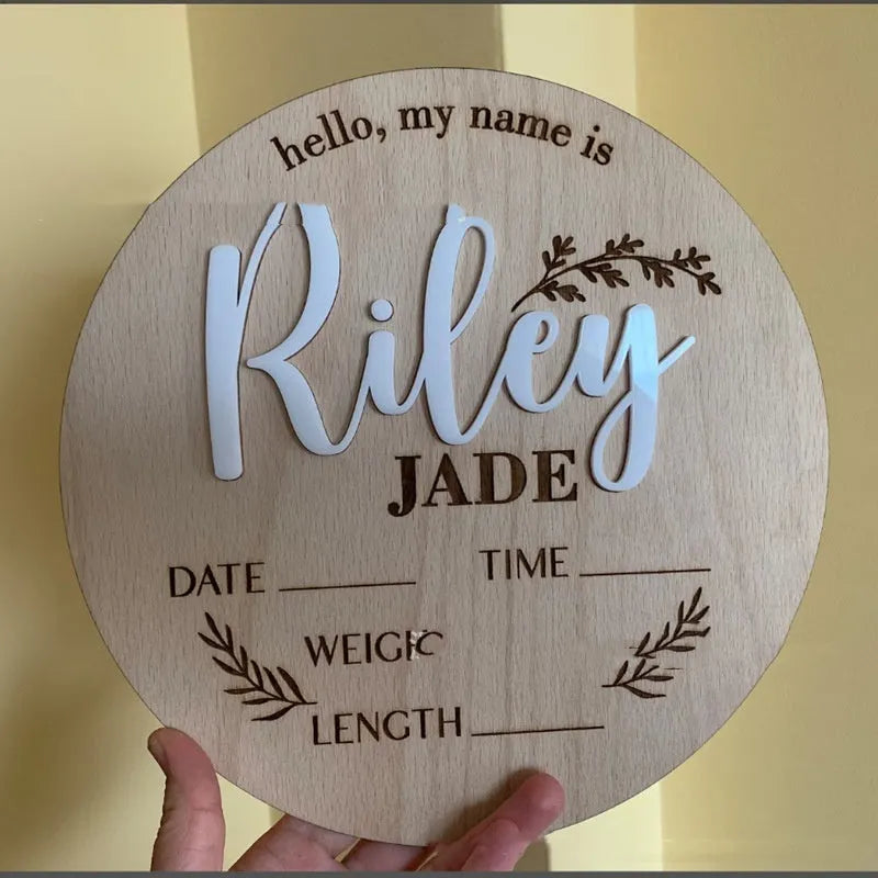 Square wooden newborn name label with birth information, 15x15cm, shown in three style variations.