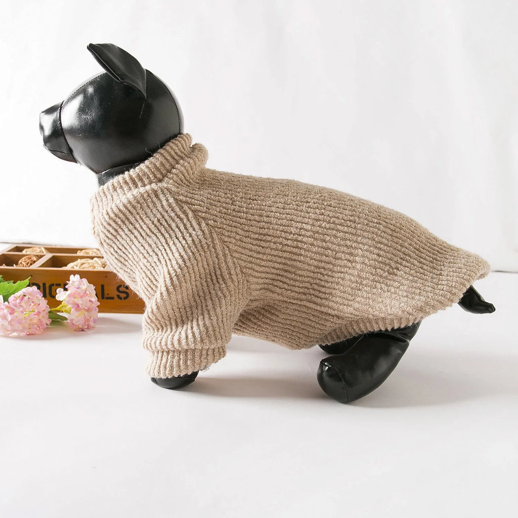 Brown knitted pullover sweater on a small dog, showing four-leg design for full coverage.