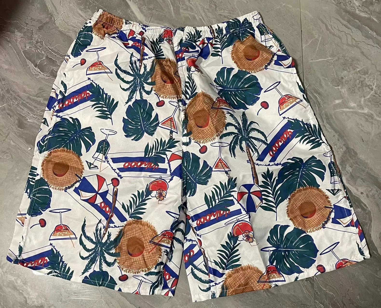 Men's floral print five-point swimming trunks made from polyester in a free size.